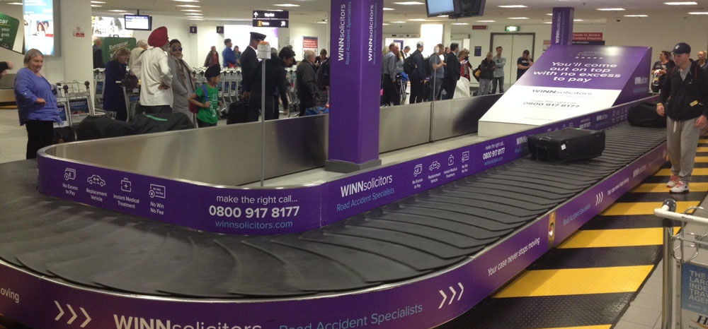 Winn Solicitors, Newcastle International Airport, Domestic Baggage Reclaim, Baggage Carousel Wrap